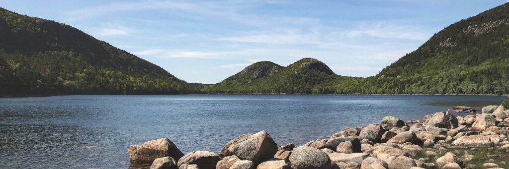 Jordan Pond in Acadia National Park with the rounded peaks of North Bubble and South Bubble rising behind it